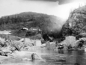 Construction of the stone piers of the Mrtvaski Viaduct on solid ground next to the Soca River. Construction of the stone piers of the Mrtvaski Viaduct on solid ground next to the Soca River.