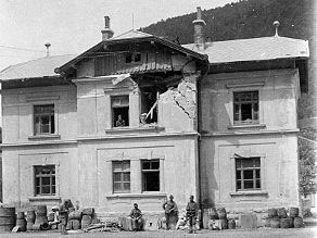 Badly damaged house at the Sveta Lucija - Tolmin (now Most na Soci) railway station. Badly damaged house at the Sveta Lucija - Tolmin (now Most na Soci) railway station.