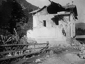 Badly damaged house at the Sveta Lucija - Tolmin (now Most na Soci) railway station. Badly damaged house at the Sveta Lucija - Tolmin (now Most na Soci) railway station.
